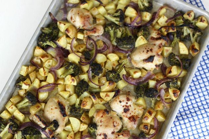 Sheet pan dinner with honey mustard chicken, broccoli, potatoes and red onions