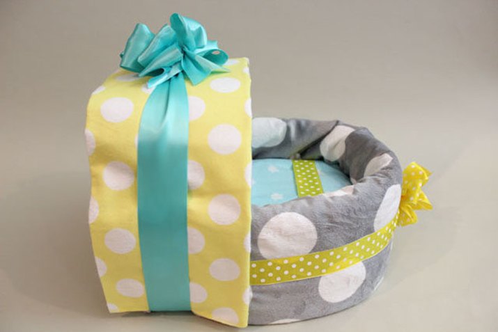 Diaper carriage with baby blankets.