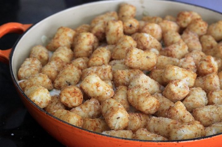 A dish of freshly baked tater tot casserole.