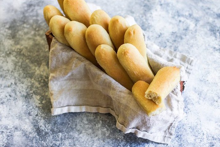 A fresh basket of warm baked breadsticks