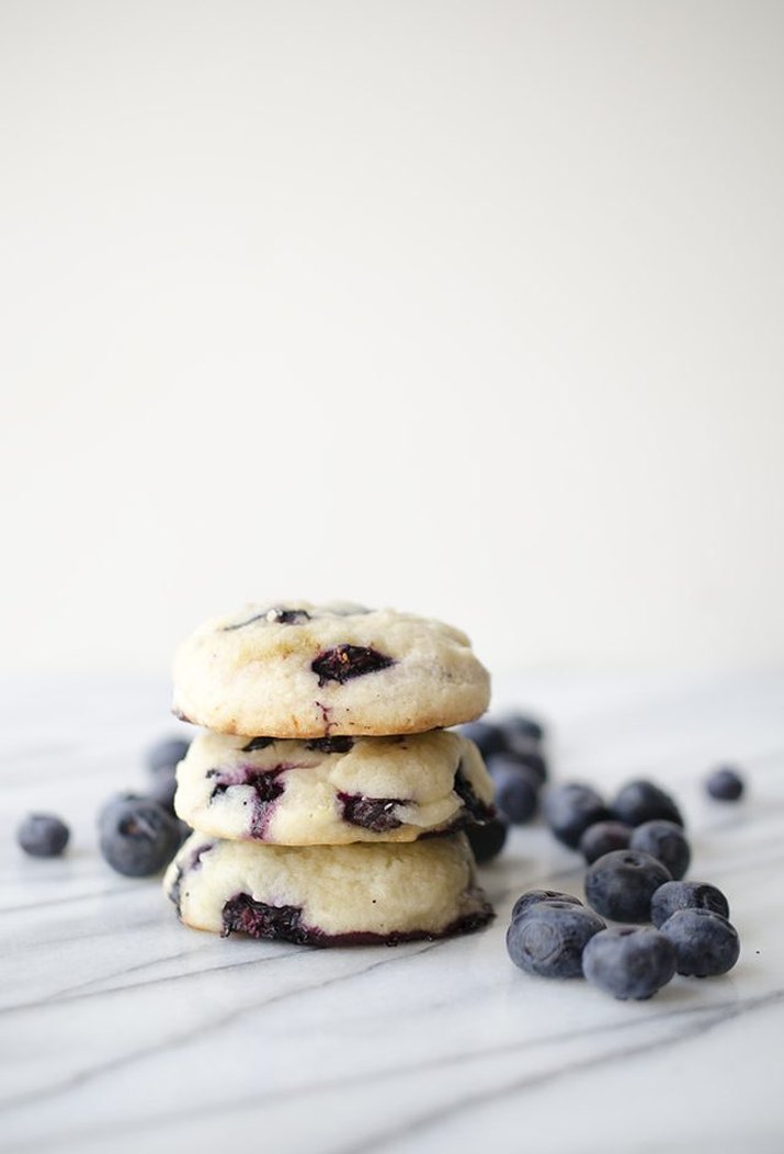 A stack of freshly made blueberries and cream cookies.